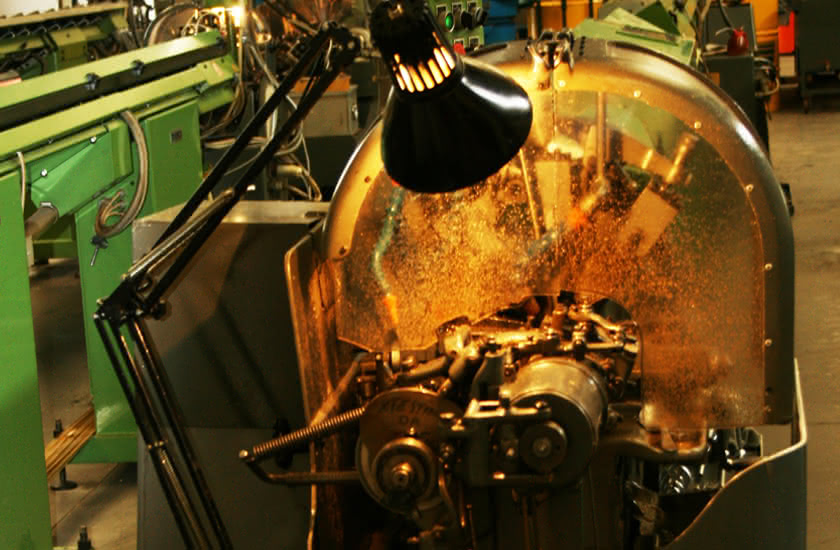 Detail of an automatic lathe in operation at Eredi Baitelli in 1968, during a period of generational transition.