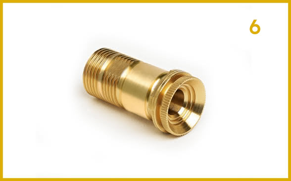 Sixth stage. Precision turning process: pick-up, reworking, and cutting on a brass turned component.